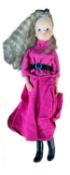 Sindy in magenta skirt and jacket with black belt, black boots and black hair bow (c1980s)