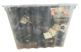 A large box containing various camera cases, retail boxes etc
