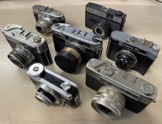 Seven vintage cameras, to include: Voigtlander Vito B; Cosmic Symbol; Cosmic 35; Yashica Minister