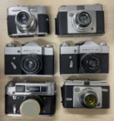 Six vintage cameras to include: Voigtlander VITO B; Ilford Sportsman; Zenit B (x2); FED-4; Ilford