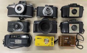 Nine vintage cameras to include: kodak Brownie 127 (x2); Argus; Salter Merit 2000; Sirius PG-1;