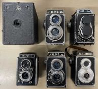 Six vintage box cameras, to include: Flexora; Halina-Prefect; Halina AI (x2); Elioflex; Houghtons