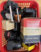 One basket of assorted camera lenses, lens caps, camera accessories etc