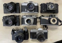 Eight vintage cameras, to include: Agilux AgiFlash; Yashica FX-2; EXA-I; Yashica TL Electo X;