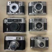 Six vintage cameras to include: Agilux Agima (x3); FED-4; Voightlander VITO C; Paxette