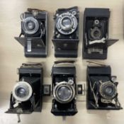 Six vintage cameras to include: Kodak No. 2 Autographic Brownie; Balda; Coronet; Kodak Siz-20