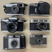 Six vintage cameras, to include: Olympus Trip 35; Edixa Prismaflex; Edixa Prismat; Olympus Pen-EE