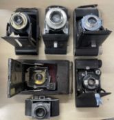 Six vintage folding cameras to include: Kodak (x2); Kodak Folding Brownie Six-20; Kershaw Eight-20