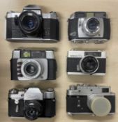 Six vintage cameras to include: Pentaflex SL; Baldessa 1b; Ilford Sportsmaster; Konica C35; Zenit 3;