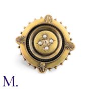An Etruscan Revival Brooch in yellow gold, the circular body set centrally with a round cut