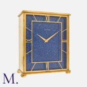 JAEGER LE COULTRE, A VINTAGE LAPIS LAZULI CLOCK, The Large Brass Body with openwork hour marker