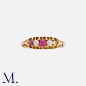 A Ruby And Diamond Ring in 18k yellow gold, set with round cut rubies and round cut diamonds, one