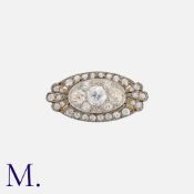 An Antique Diamond Ring in yellow gold and silver, set with three principal old cut diamonds,