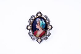 14kt gold brooch/pendant with silver details. This piece of jewelry can be worn as a pendant or used