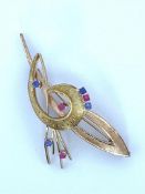 14kt bicolor gold brooch set with syn. ruby and syn. blue spinel.
The brooch is made in 14kt yellow 