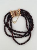 14kt yellow gold bracelet with imitation garnet and rice pearls.
The bracelet has a beautiful box cl