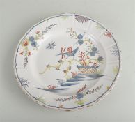 A fiance polychrome painted dish with decoration of birds and flowers, marked 'A' on the back. Franc