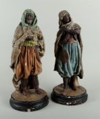 A set of two plaster polychrome painted statues of Arab figures, marked BB on the bottom. Circa 1900