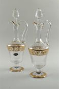 Two crystal decanters on foot, with gilded accents, Saint Louis Paris.
H. 40 cm.