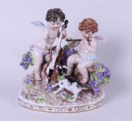 A porcelain group depicting two putti playing music, marked Sitzendorf. Germany, 20th century.
23 x 