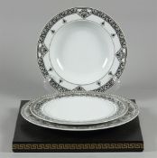 A lot of porcelain consisting of a dinner plate, breakfast plate and soup plate with Marquetry decor
