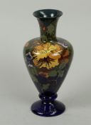 Earthenware vase with polychrome stylized floral decoration, Painter H.G.A. Huyvenaar. Rozenburg, ci