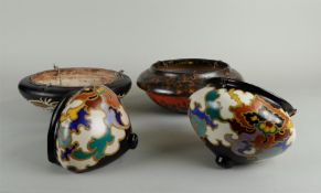 A lot of four earthenware (hanging) planters with floral decoration. Gouda, early 20th century. One 