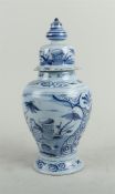 An earthenware covered vase with a decoration of a figure in a garden. Delft, 18th century.
H. 32 cm