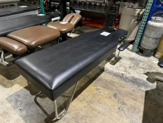 ADJUSTING TREATMENT TABLE WITH ARM REST