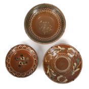 THREE PAINTED EARTHENWARE BOWLS