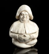 A CARVED IVORY FIGURAL SMALL BOX IN SHAPE OF A BEGGAR