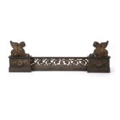 A French cast iron and parcel gilt fireplace fender