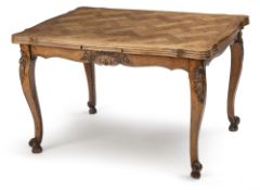 A French oak extending dining table