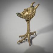A BRASS OIL LAMP WITH FAUN HEAD