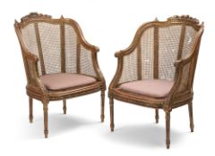 A pair of giltwood bergeres