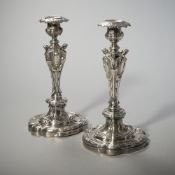 A PAIR OF BAROQUE STYLE SILVER CANDLESTICKS