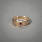 RING WITH SMALL RED COLOURED STONE