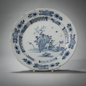 A BLUE AND WHITE PAINTED FAIENCE DISH
