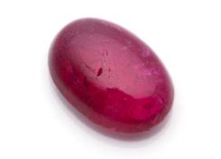 A RED TOURMALINE CABOCHON