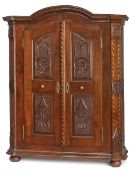A NEOCLASSICAL BRASS MOUNTED CARVED OAKWOOD FRUITWOOD AND BOG OAK CUPBOARD