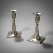 A PAIR OF SILVER CANDLESTICKS
