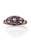 A gold and ruby ring