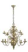 A FLEMISH TWELVE-LIGHT BALUSTER SHAPED BRASS CANDELABRA