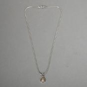 A DIAMOND PENDANT WITH NECKLACE