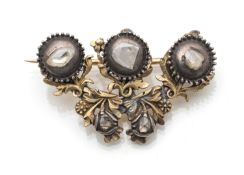 A gold and diamond brooch