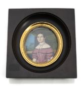 A PORTRAIT MINIATURE OF A LADY IN A RED DRESS IN FRONT OF A WINDOW