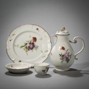 A COFFEEPOT, A CUP AND SAUCER AND A PLATE WITH FLORAL PATTERN