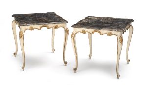 A pair of German white painted and marbleized side tables