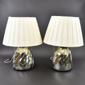 A pair of mirrored glass table lamps