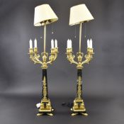 A pair of French ormolu and green marble table lamps